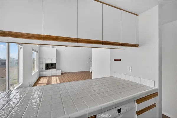 a kitchen with stainless steel appliances granite countertop a sink and a stove