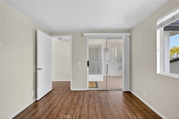 a view of an entryway with wooden floor