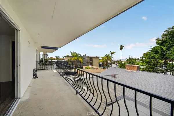 a balcony view with a garden