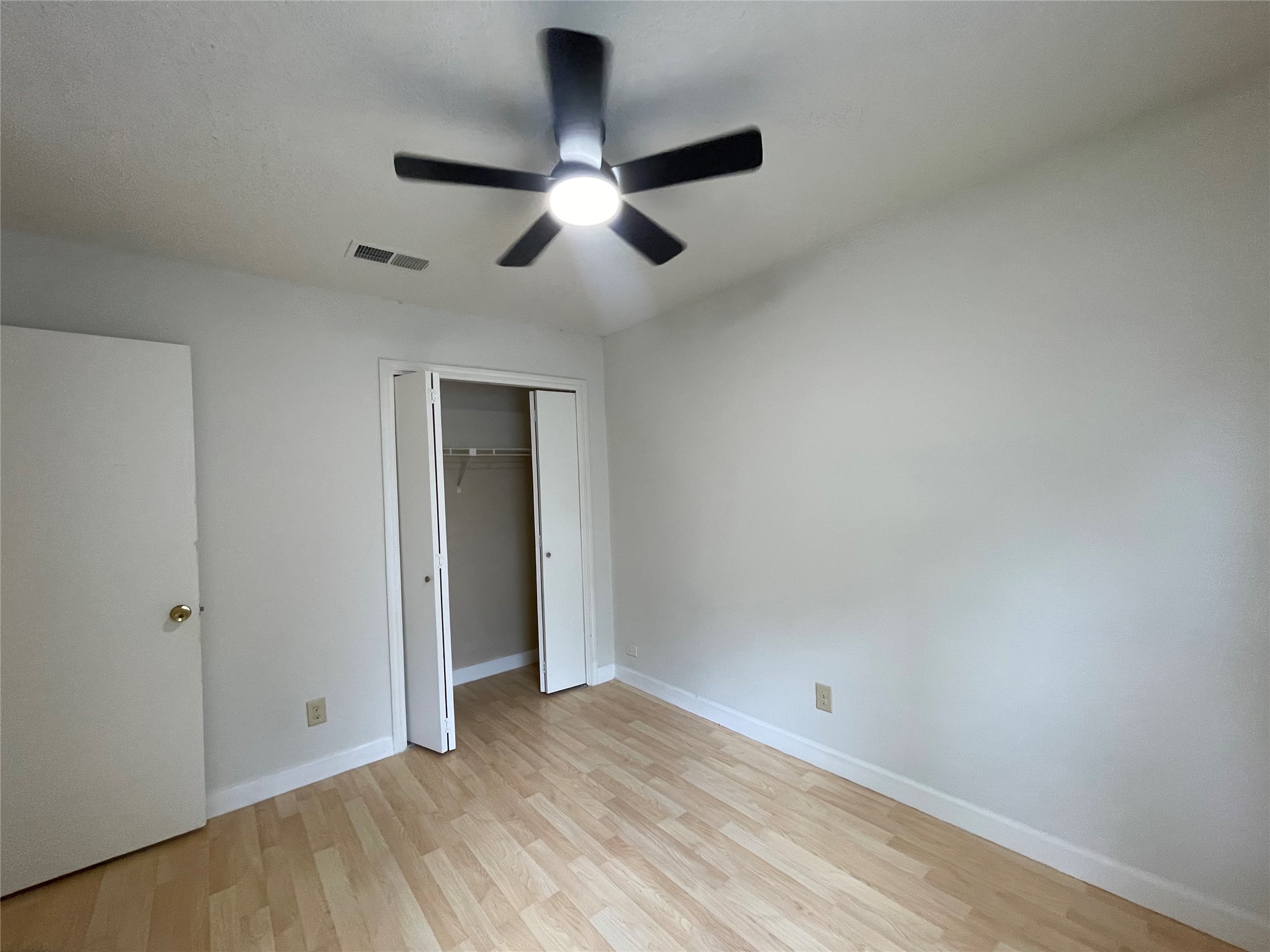 2031 Redwing Way Round Rock, TX 78664 - Photo 17 of 25 A well-proportioned bedroom with resilient flooring and a ceiling fan, ready for personal touches.