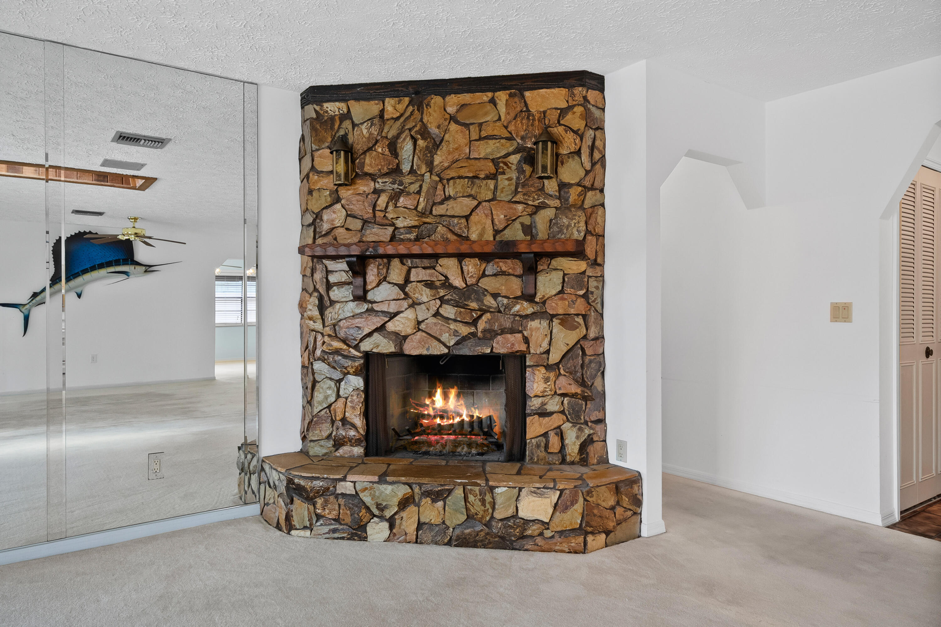 1545 Southwest Dyer Point Road Palm City, FL 34990 - Photo 19 of 44 Cozy stone fireplace.