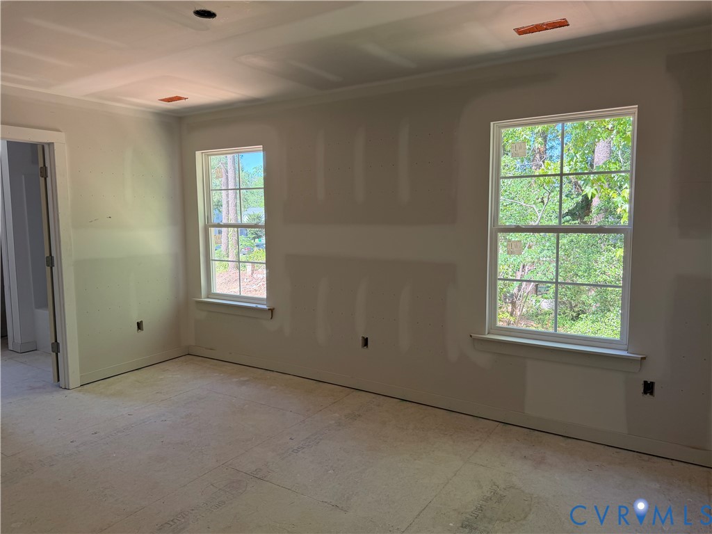 21305 Rutledge Avenue Petersburg, VA 23803 - Photo 8 of 14 an empty room with windows