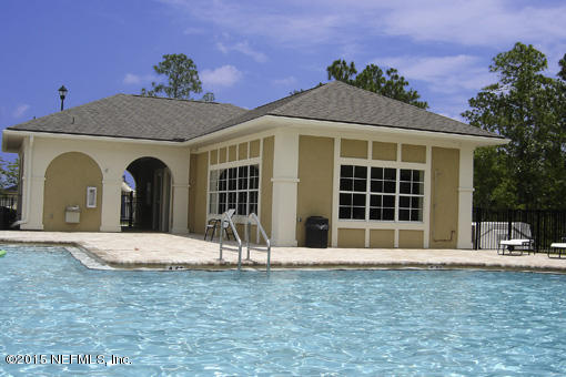 1104 Golden Lake Loop St. Augustine, FL 32084 - Photo 5 of 6 a front view of a house with a yard