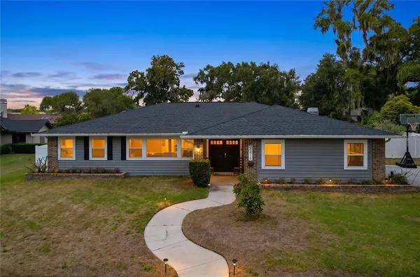 front view of a house with a yard