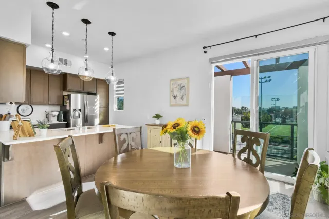 a dining room with furniture and wooden floor