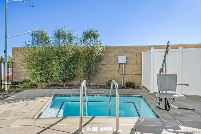 a view of a patio with couches and potted plants