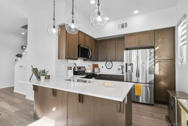 a kitchen with a refrigerator a sink and a refrigerator