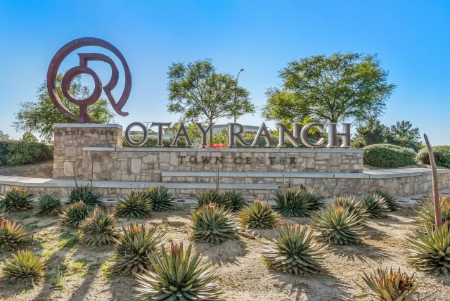 a view of a street with a bench in front of it
