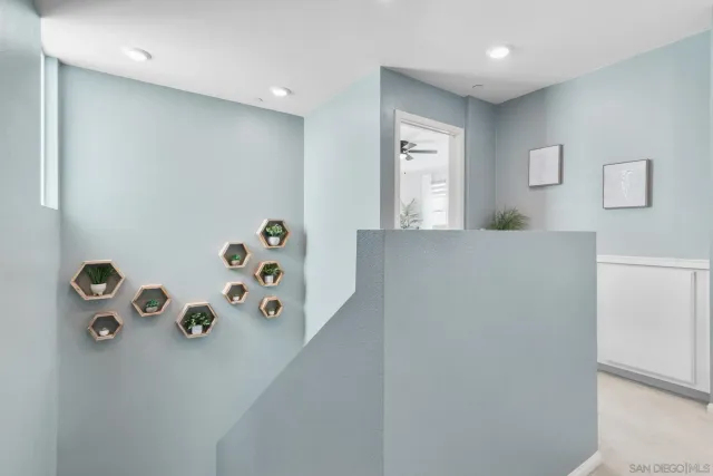 a view of hallway with bathroom