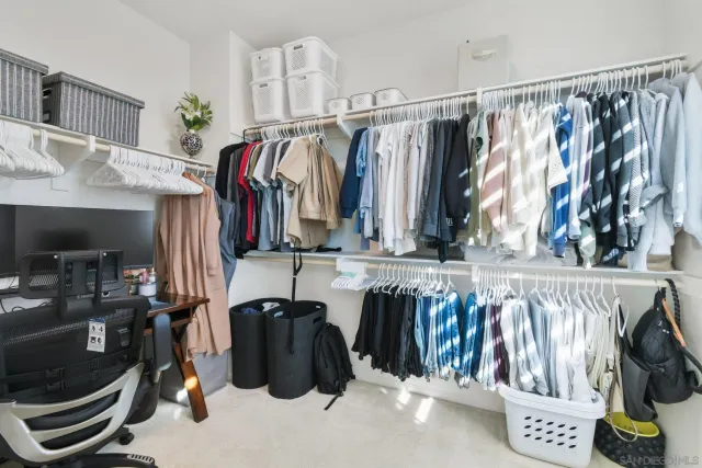 a bathroom with a double vanity sink and shower