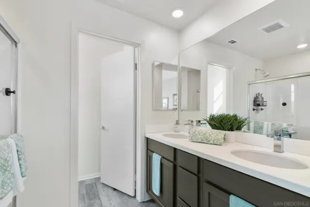 a bedroom with two beds and painted walls