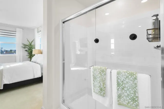 a bedroom with a bed and a television