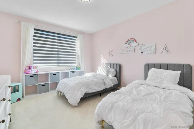 a bathroom with a sink a toilet a shower curtain and a bath tub