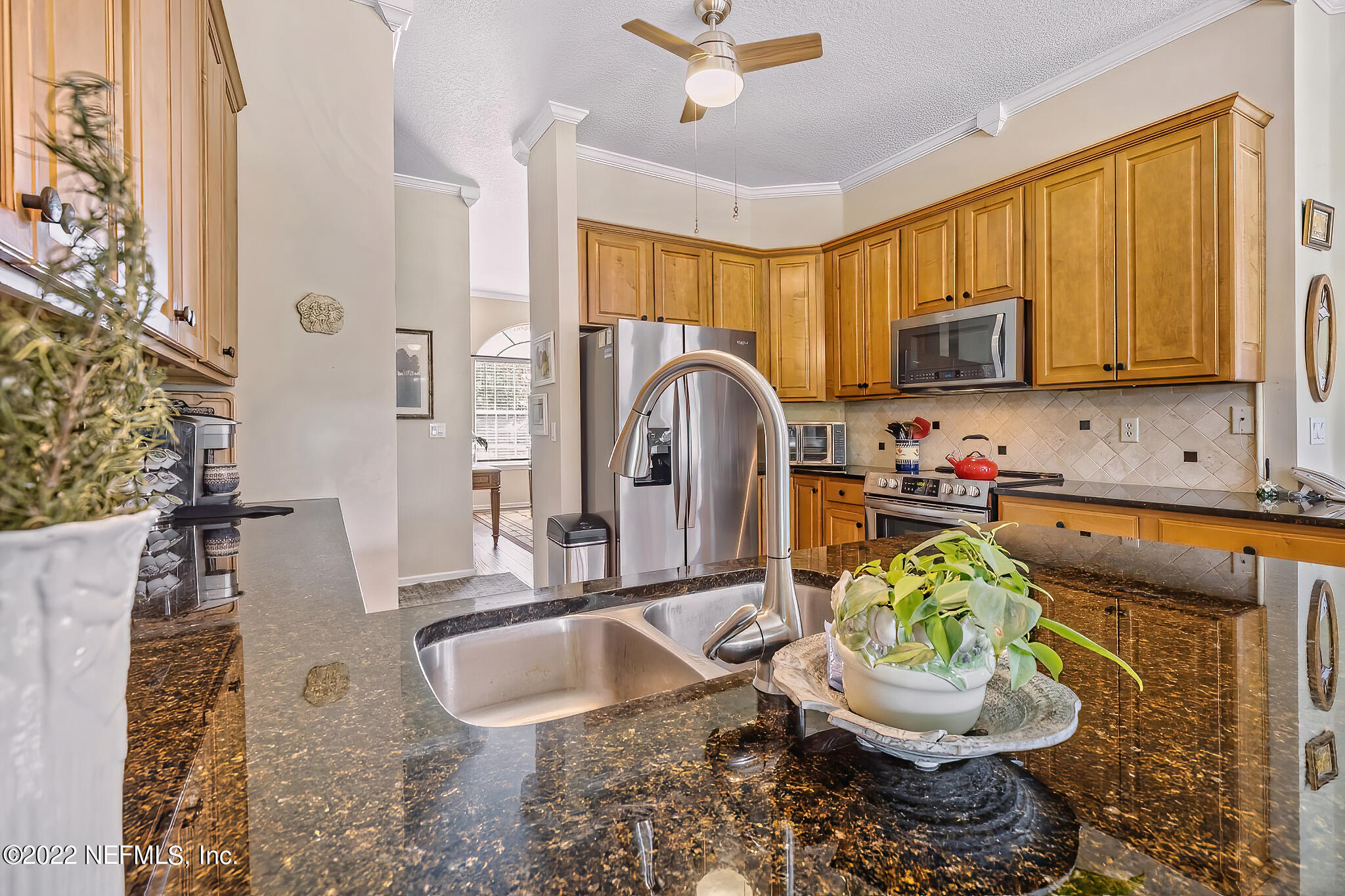 855 East Red House Branch Road St. Augustine, FL 32084 - Photo 11 of 43 a kitchen with a sink a stove and a window