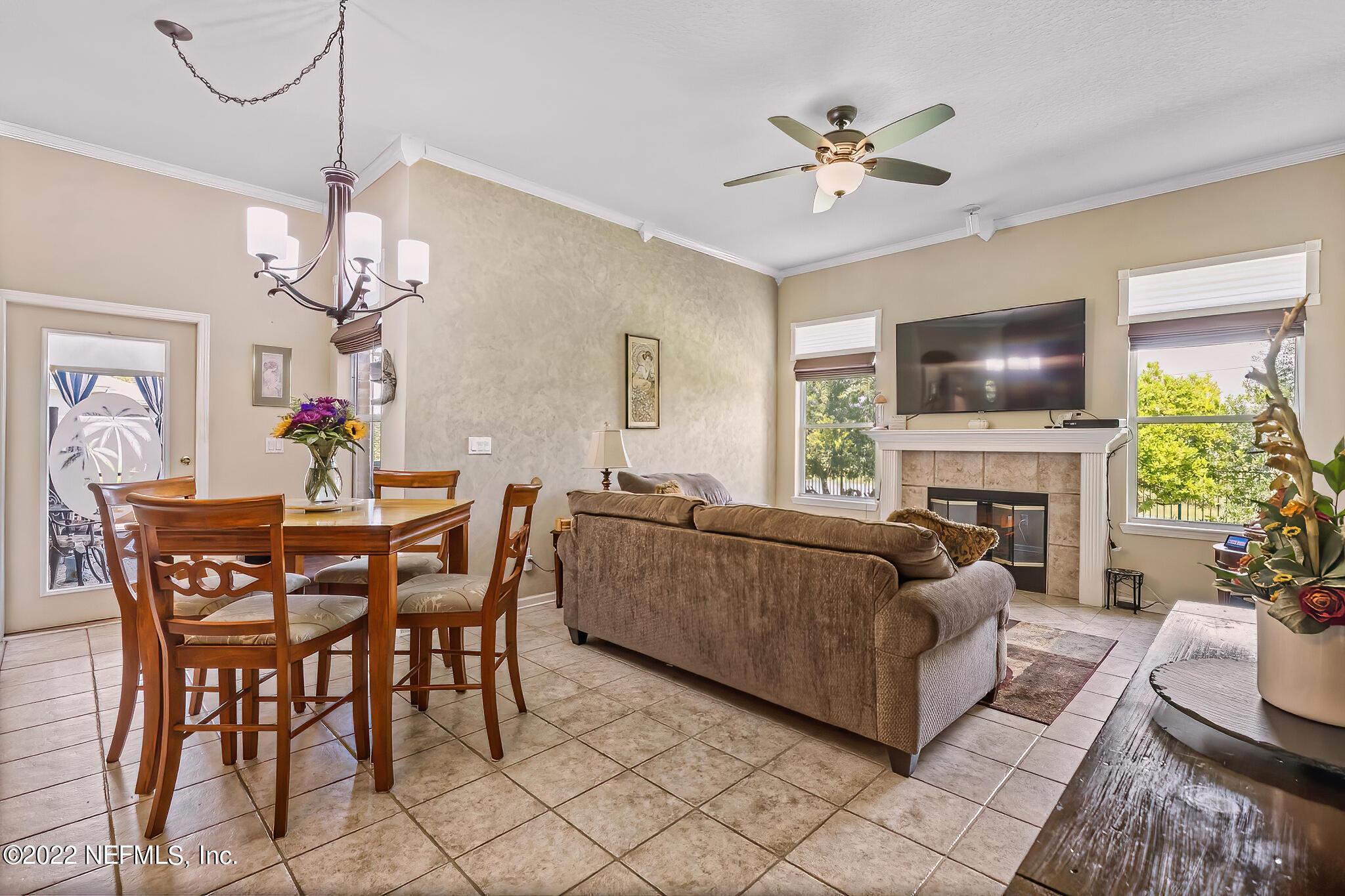 855 East Red House Branch Road St. Augustine, FL 32084 - Photo 13 of 43 a living room with furniture a chandelier and a fireplace