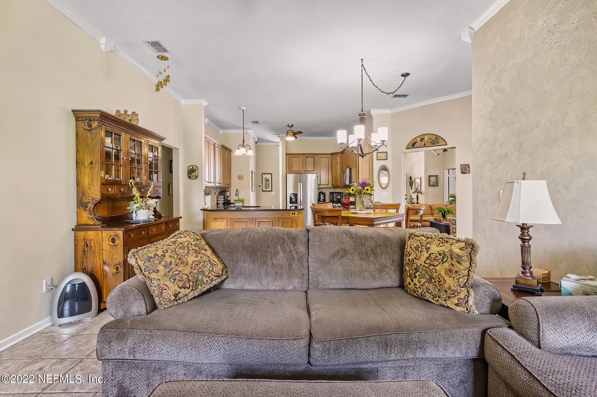 855 East Red House Branch Road St. Augustine, FL 32084 - Photo 15 of 43 a living room with furniture and a chandelier