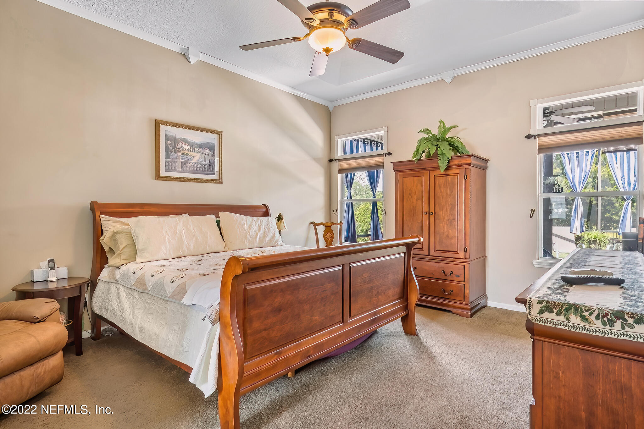 855 East Red House Branch Road St. Augustine, FL 32084 - Photo 18 of 43 a spacious bedroom with a bed and a window
