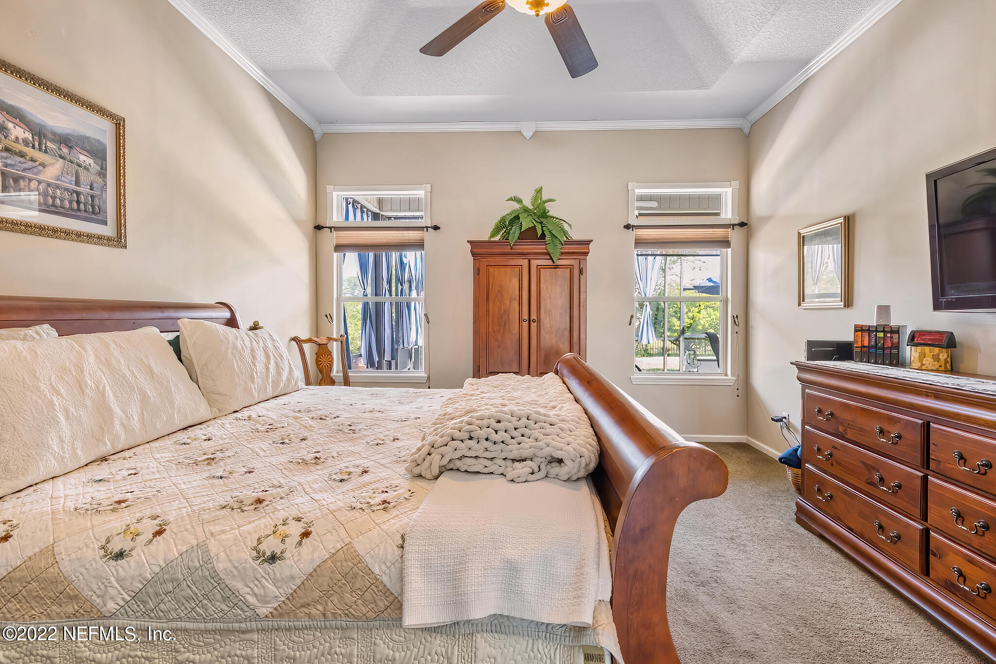 855 East Red House Branch Road St. Augustine, FL 32084 - Photo 19 of 43 a bedroom with a bed and wooden floor