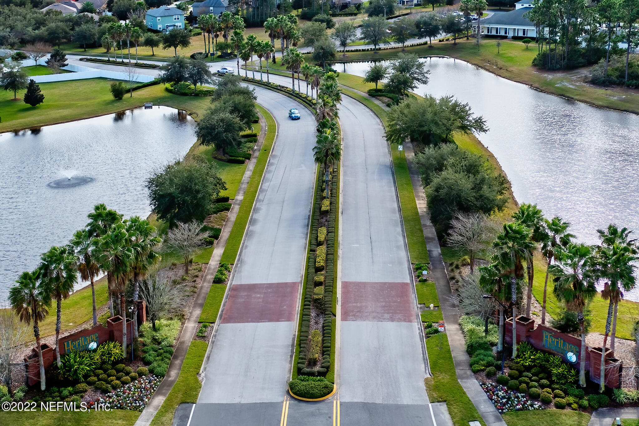 855 East Red House Branch Road St. Augustine, FL 32084 - Photo 2 of 43 an aerial view of a house with garden space and lake view