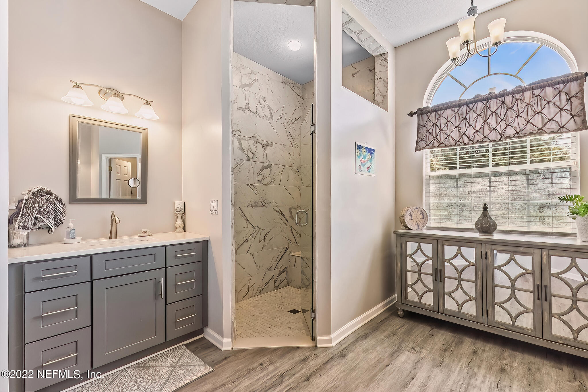 855 East Red House Branch Road St. Augustine, FL 32084 - Photo 21 of 43 a bathroom with a sink a mirror and a shower