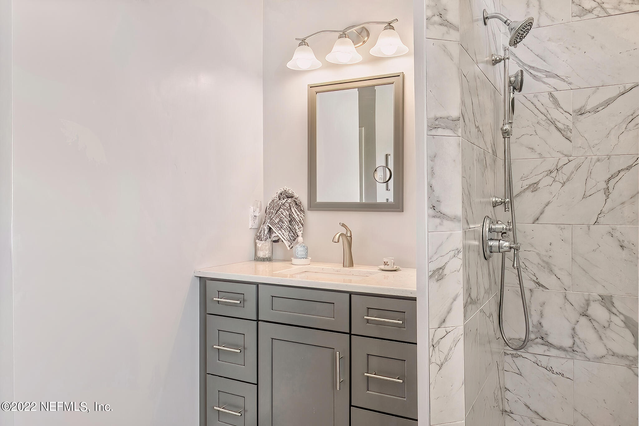 855 East Red House Branch Road St. Augustine, FL 32084 - Photo 22 of 43 a bathroom with a sink and a mirror