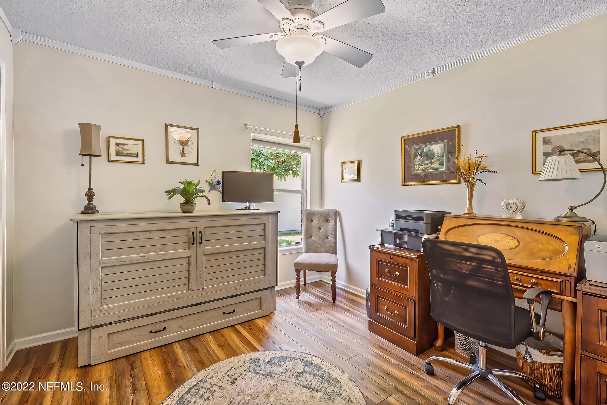855 East Red House Branch Road St. Augustine, FL 32084 - Photo 26 of 43 a bedroom with a bed and a chandelier