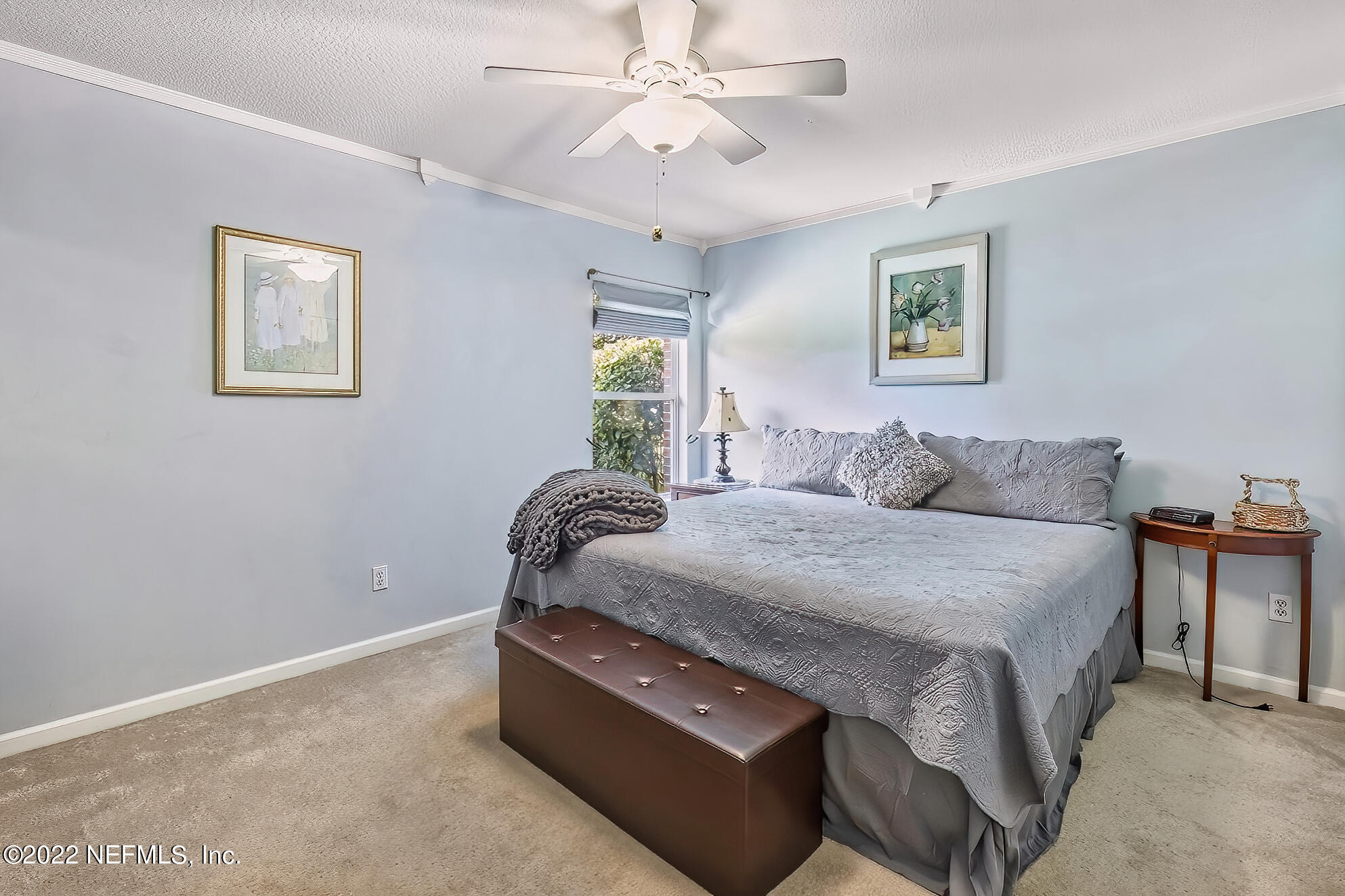 855 East Red House Branch Road St. Augustine, FL 32084 - Photo 28 of 43 a spacious bedroom with a bed and a table