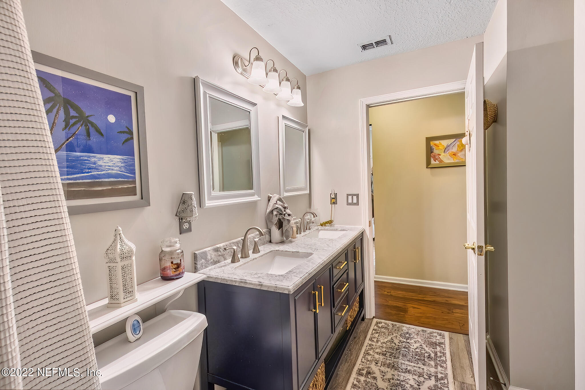 855 East Red House Branch Road St. Augustine, FL 32084 - Photo 31 of 43 a bathroom with a tub sink and mirror