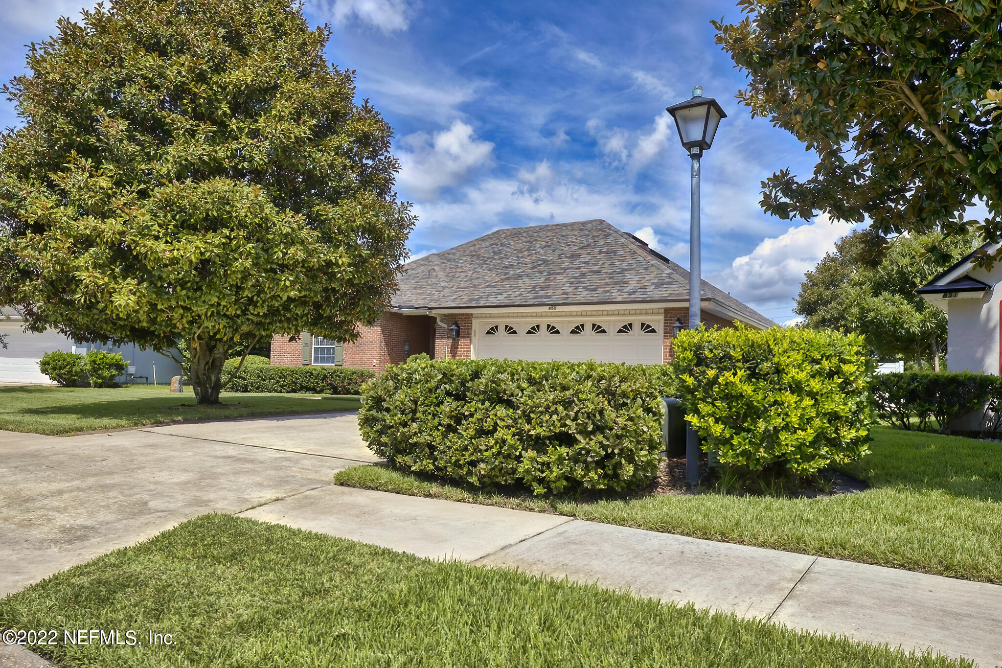 855 East Red House Branch Road St. Augustine, FL 32084 - Photo 43 of 43 a front view of a house with a garden