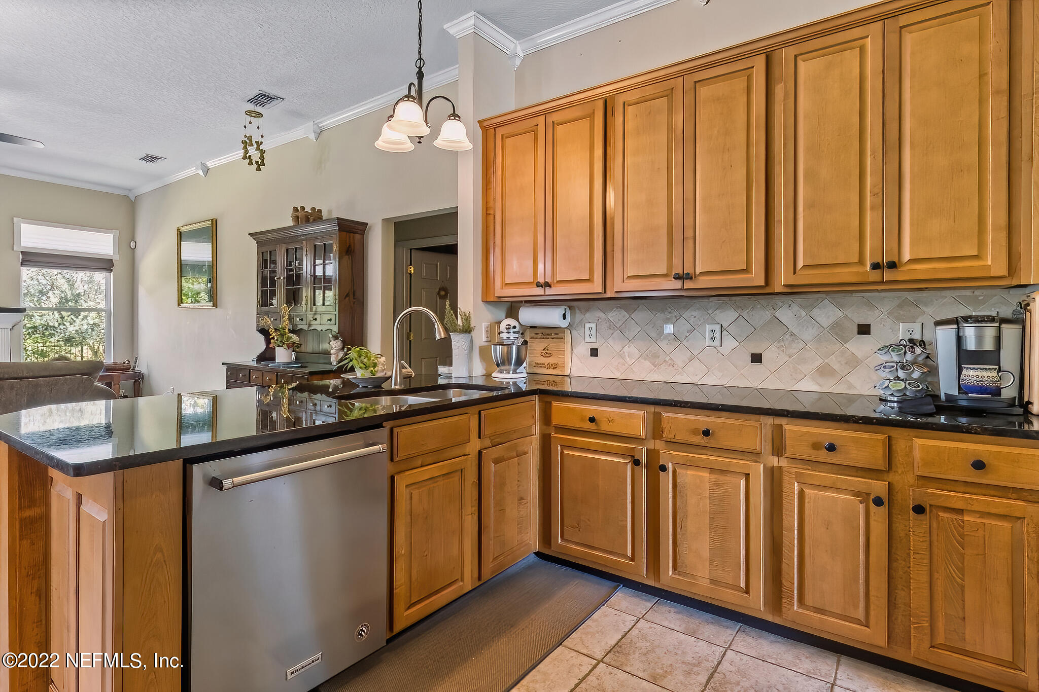 855 East Red House Branch Road St. Augustine, FL 32084 - Photo 10 of 43 a kitchen with stainless steel appliances granite countertop a sink and cabinets