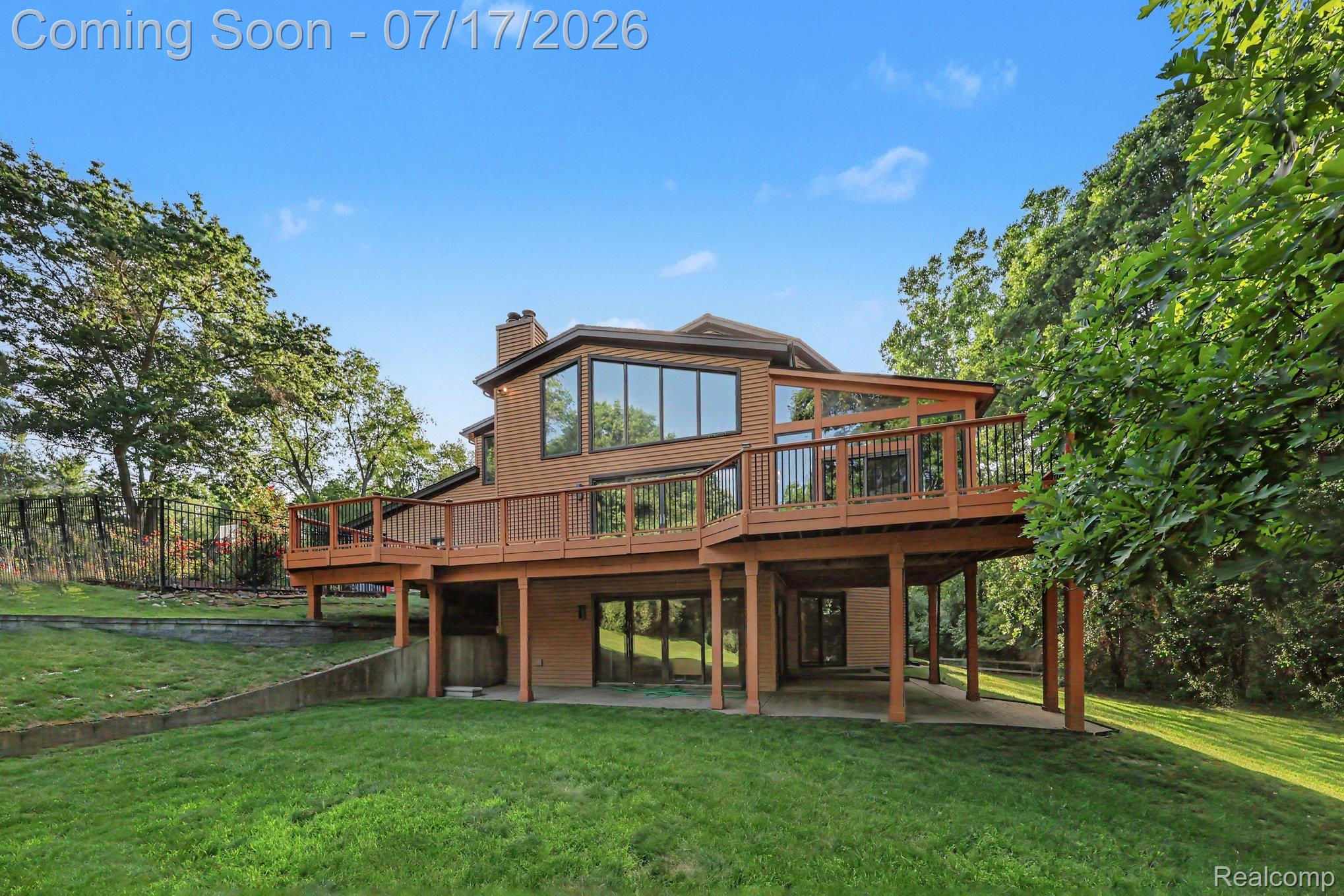 5685 Paint Valley Drive Rochester, MI 48306 - Photo 36 of 66 Expansive multi-level deck with wood flooring and dark railings