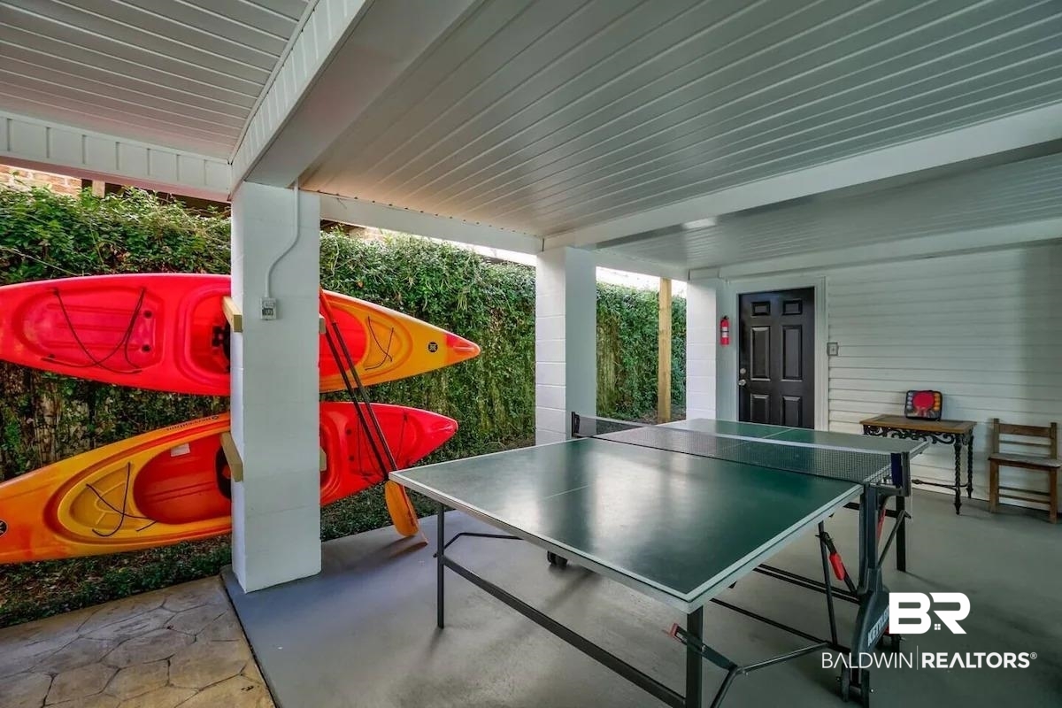 16297 Honey Road Summerdale, AL 36580 - Photo 21 of 24 Covered outdoor patio space with a solid ceiling, concrete flooring, and a privacy hedge