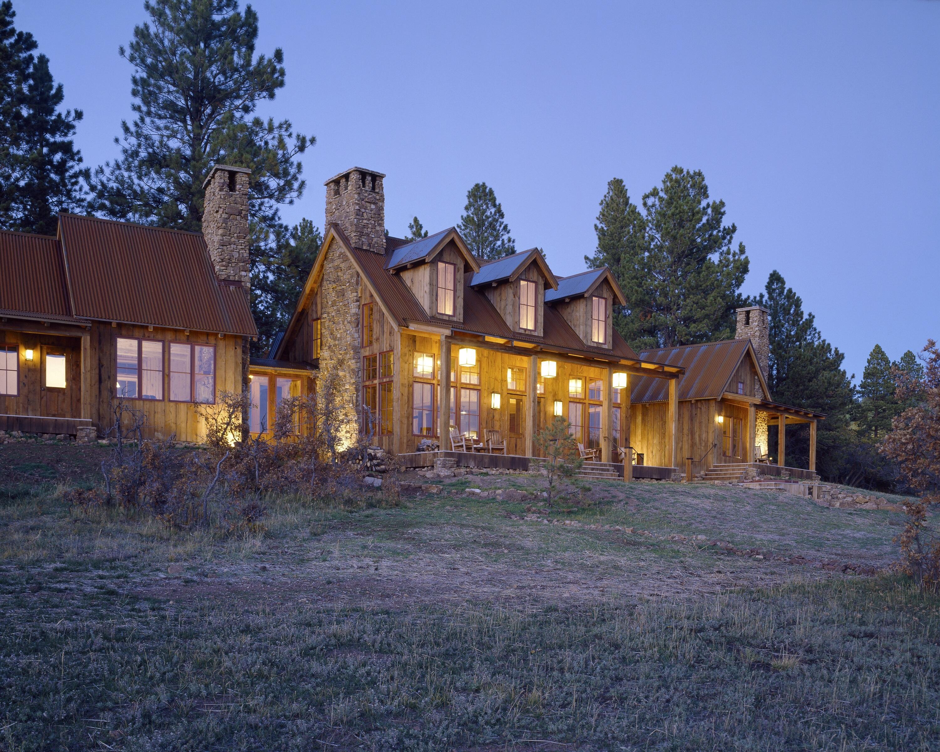 a view of a house with a yard and tree s