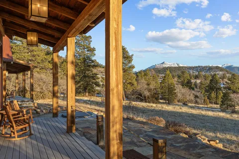 a view of a balcony with wooden floor