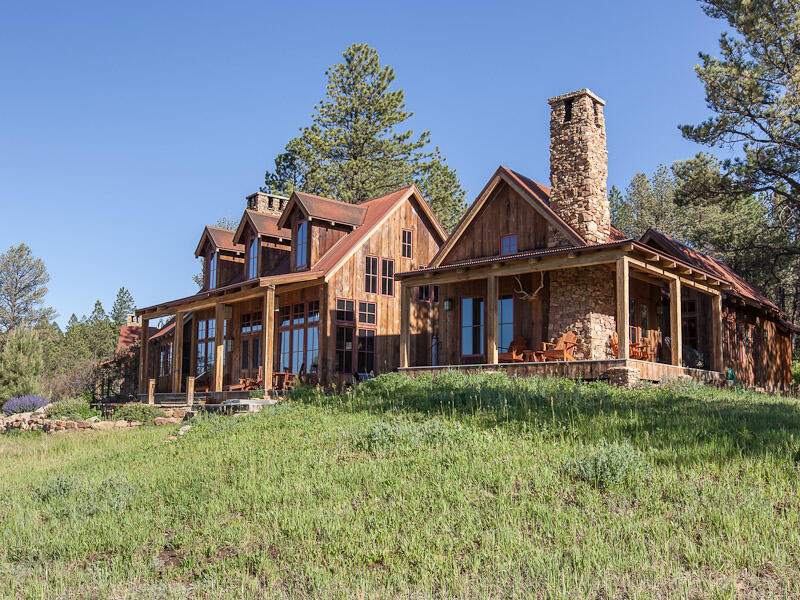 484 Gutshall Lane Placerville, CO 81430 - Photo 22 of 32 a front view of a house with a garden