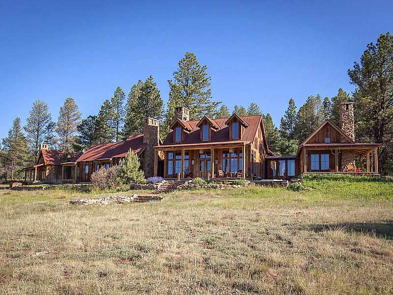 484 Gutshall Lane Placerville, CO 81430 - Photo 3 of 32 a backyard of a house with wooden floor and outdoor space