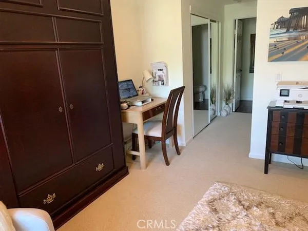 a workspace with furniture and window