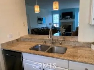 a kitchen with a sink and a stove