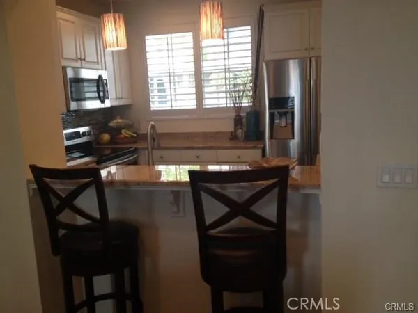 a room with chairs and window