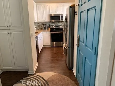 a view of a kitchen from the hallway