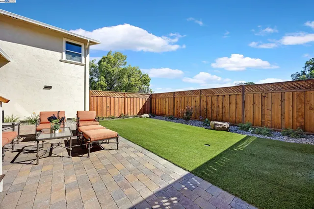 a view of backyard with seating space