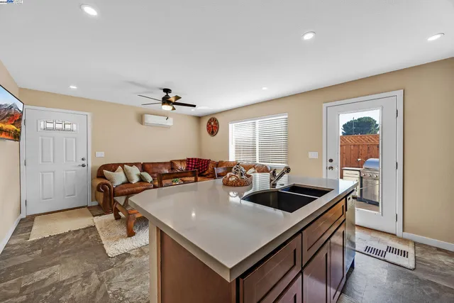 a kitchen with a stove a refrigerator and a sink