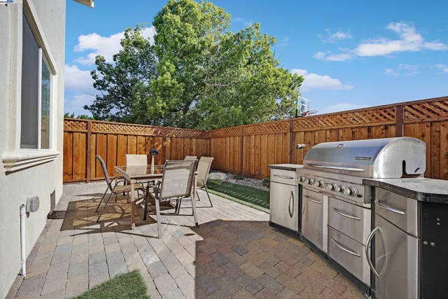 a view of a chairs and table in the patio
