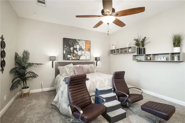 a bedroom with furniture and a chandelier