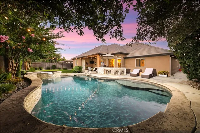 a view of a house with swimming pool