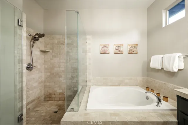 a bath tub sitting next to a shower