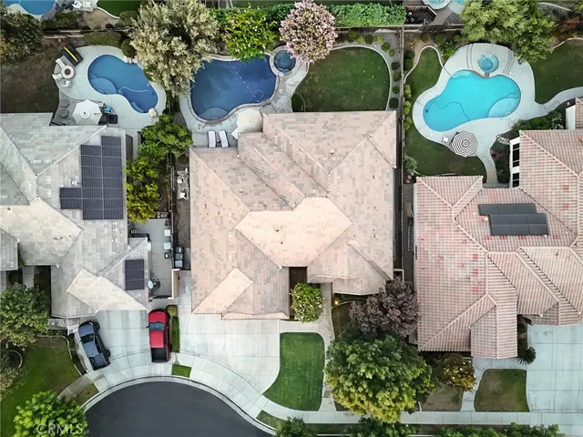 an aerial view of a house with yard