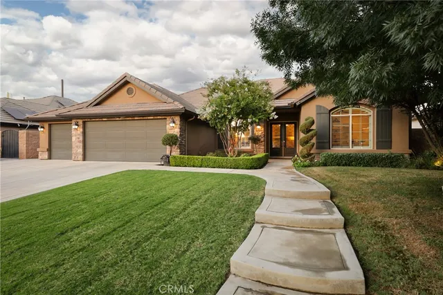 a front view of a house with yard