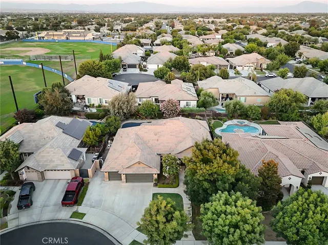 an aerial view of a houses with outdoor space