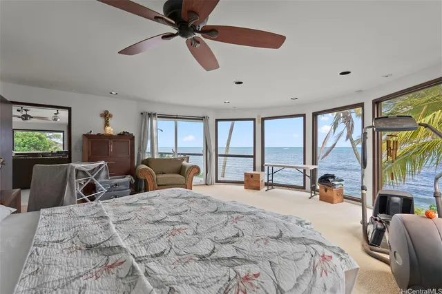 a bed room with a bed and a large window